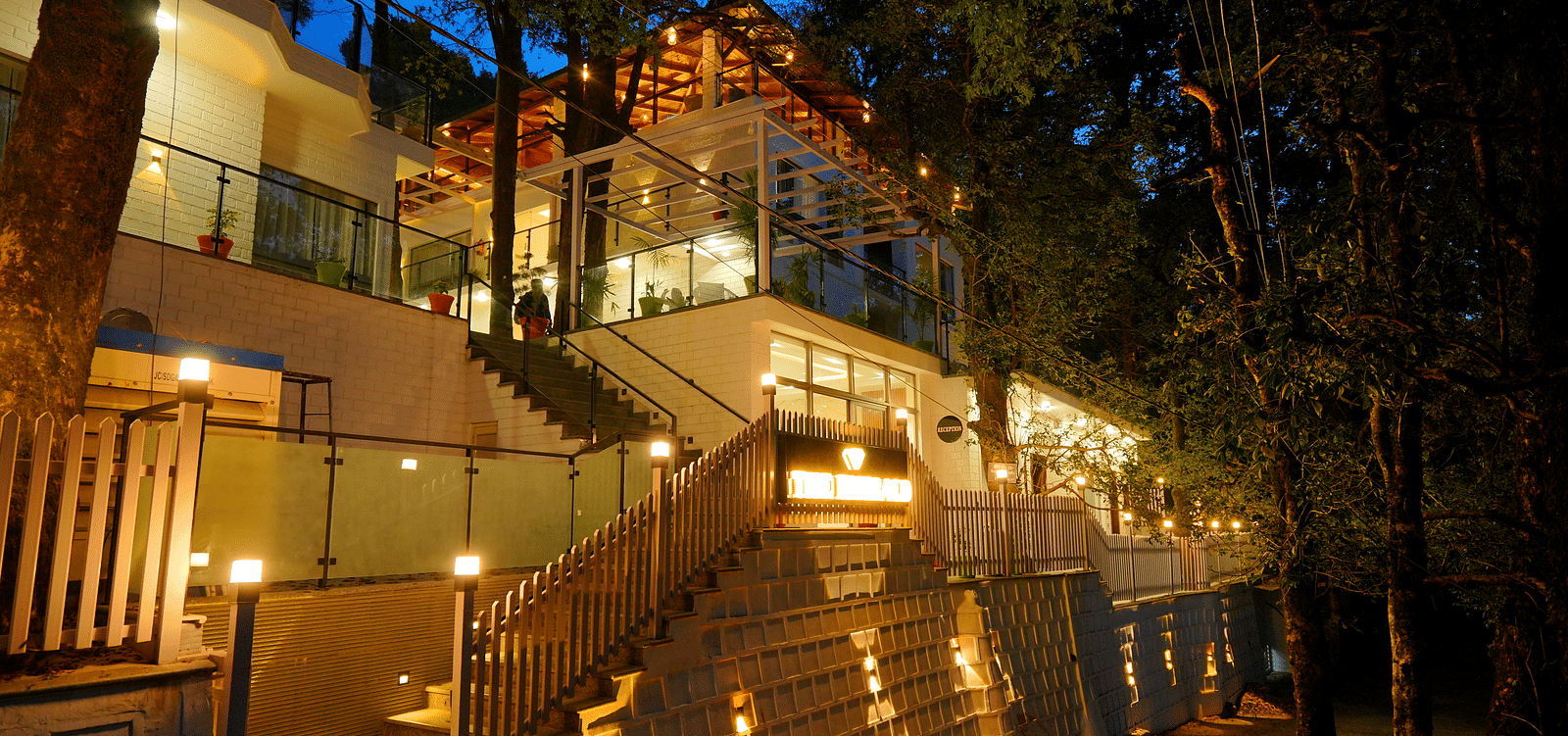 A facade image shot at night  of DLS The Emerald, Nainital which is lit with bright lighting